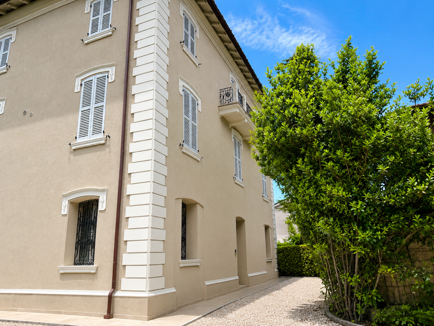 Historic villa facade and private garden path